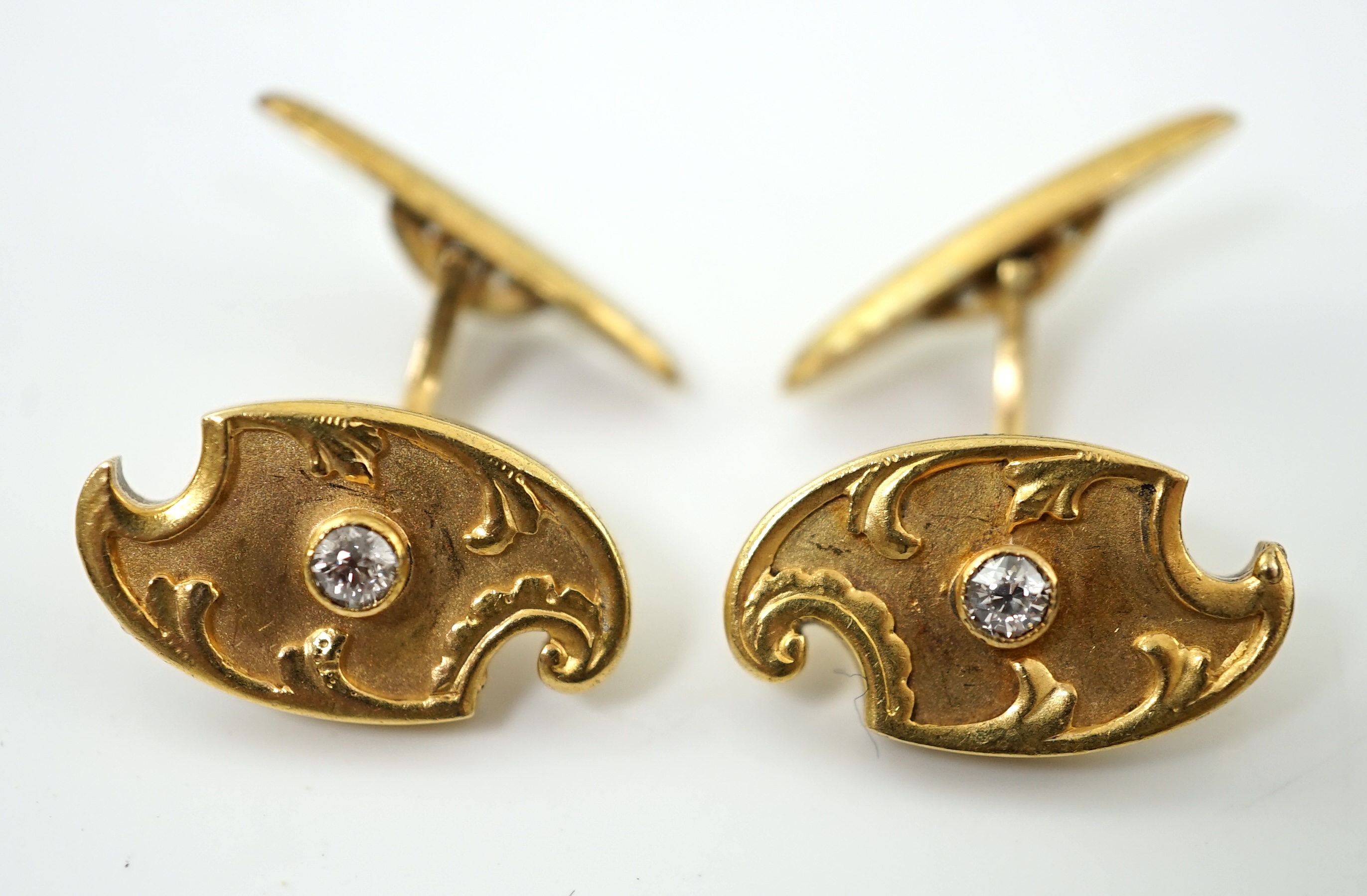 A pair of Russian 56 zolotnik gold and solitaire diamond set cufflinks